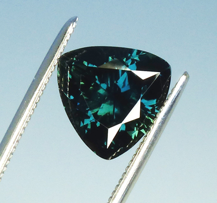 deep blue sapphire with green highlights