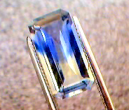 yellow sapphire with blue arrow