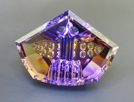 fancy carved faceted ametrine with optical dishes