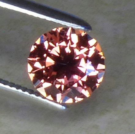 certed 68pt round orange to pink sapphire