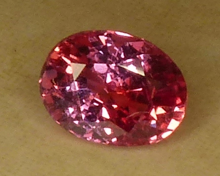 pinkish orange 91pt oval sapphire - certed