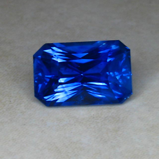 glowing blue emerald cut sapphire