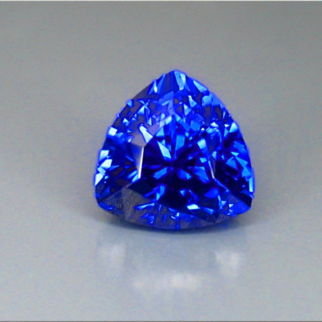 glowing blue sapphire trilliant